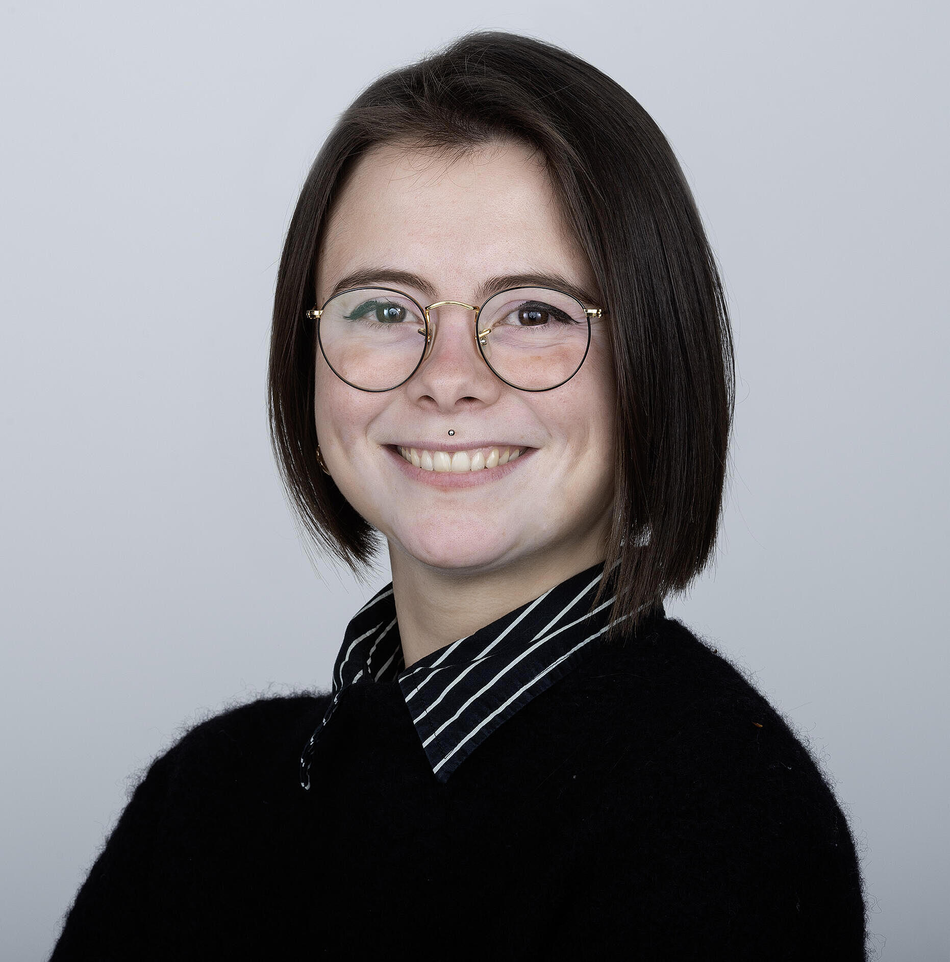 Giulia_Barison Frau mit kurzen braunen Haaren und brille. Giulia Barison