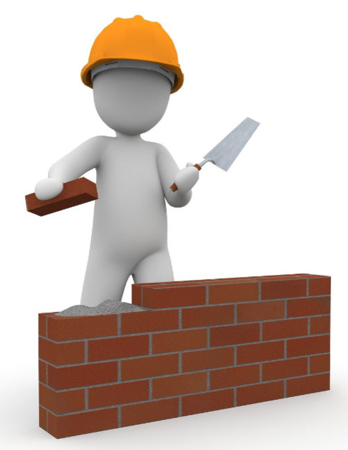 Figur baut eine Mauer